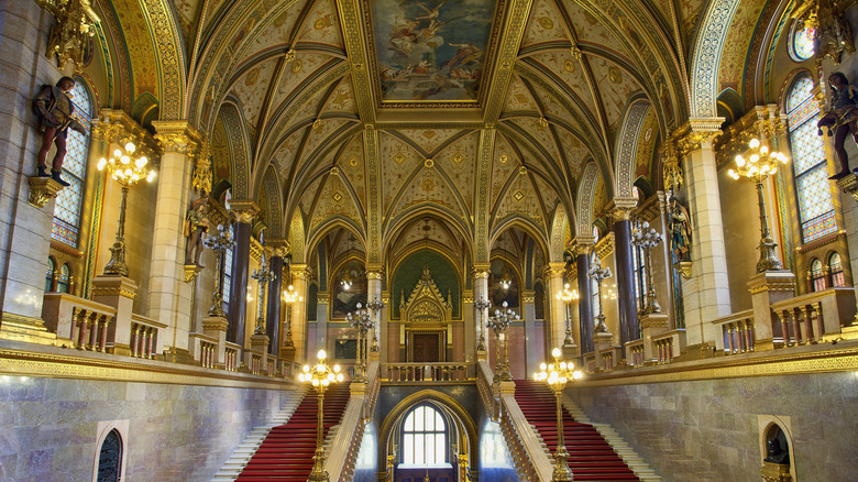 Gold vaulted ceiling, staircases,and lamps inside the Hungarian Parliament Building