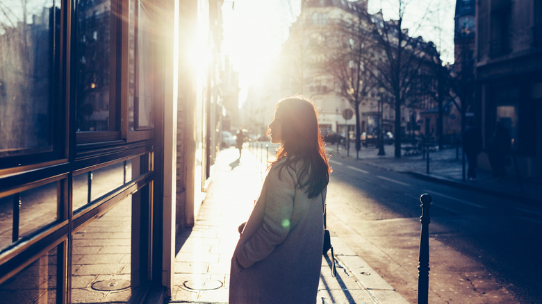 a woman shopping in paris at sunset