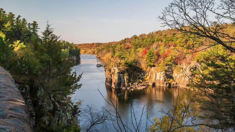 A river cruise on the St. Croix river surrounded by tall cliffs