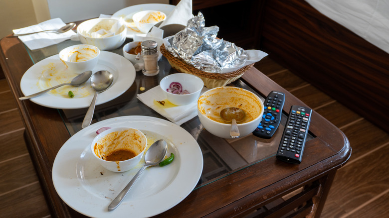 Messy dishes in a hotel room