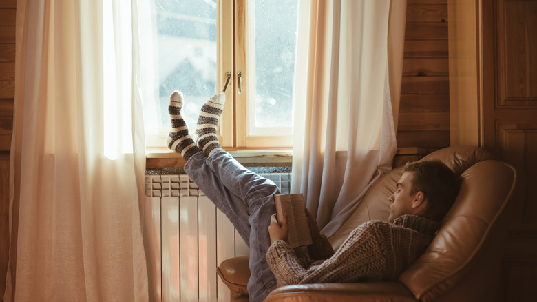 Man reading in a cabin