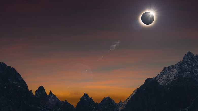 eclipse over mountains