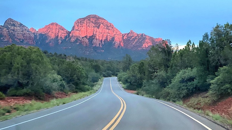 Road leading toward red mountains