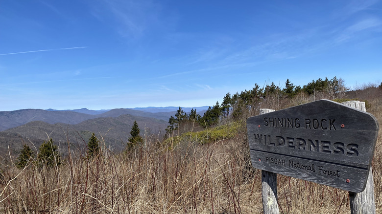 shining rock sign with mountain landscape
