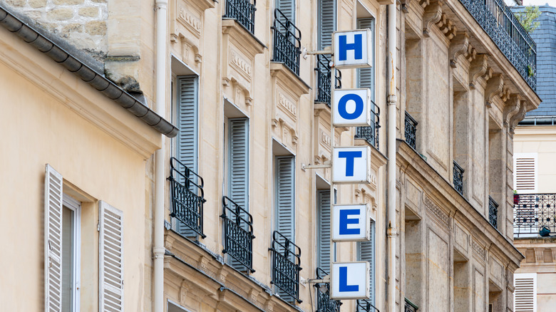 Building in Paris with HOTEL sign outside