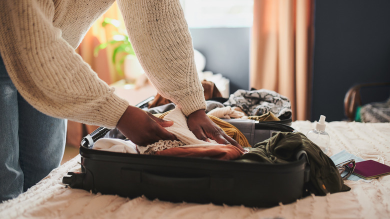 Woman packing a suitcase