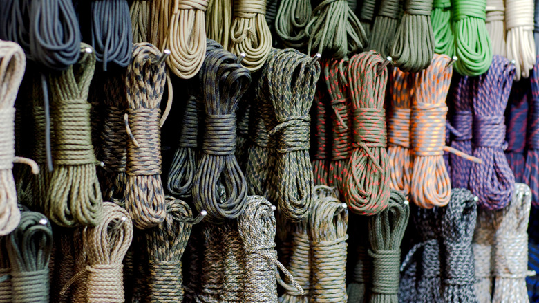 Wrapped paracord ropes hang from hooks