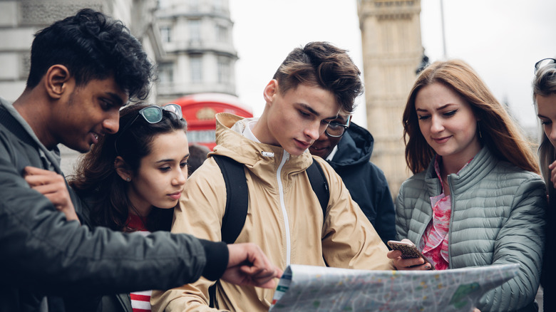 Tourists in Europe with map