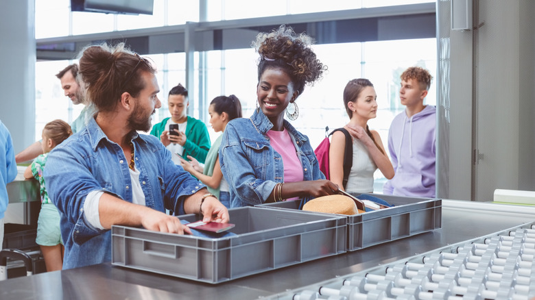 passengers going through security