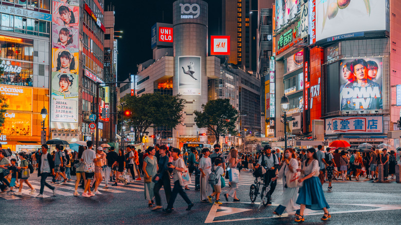 Crowded Tokyo city street crossing in Shibuya