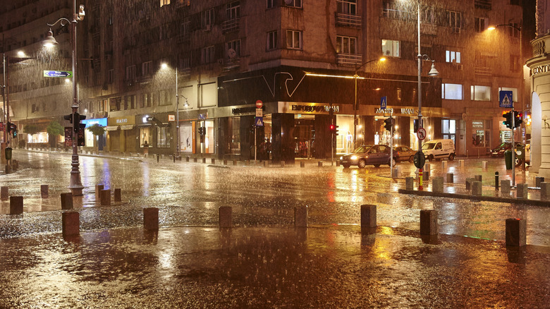 Romania, Bucharest, Victory Avenue at night in the pouring rain