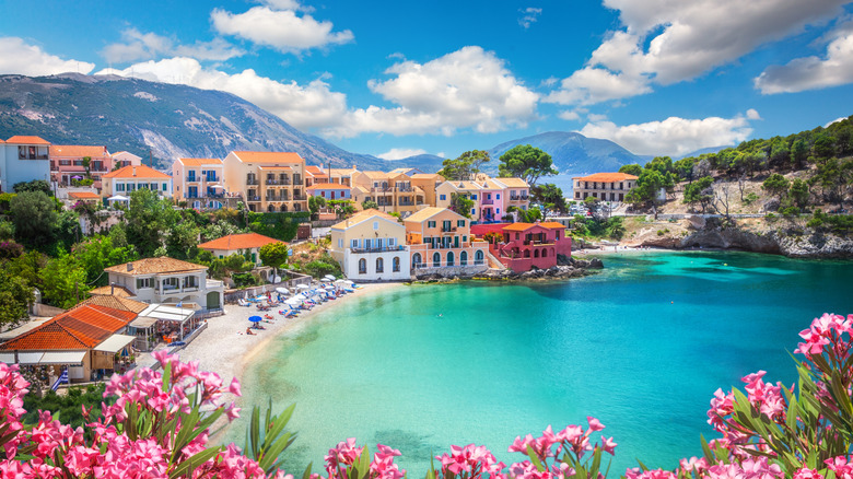 aerial view of Greek village and beach by bay