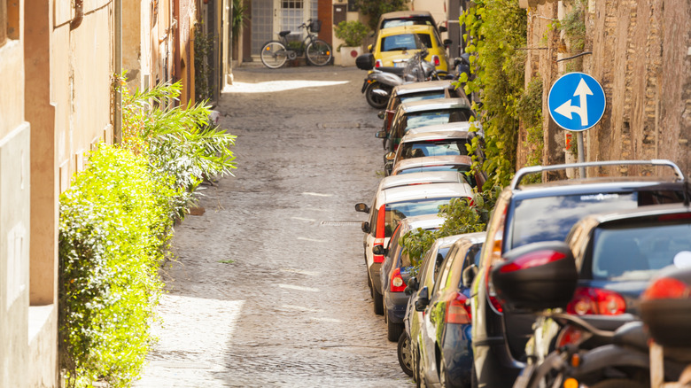 row of cars in street of rome, italy