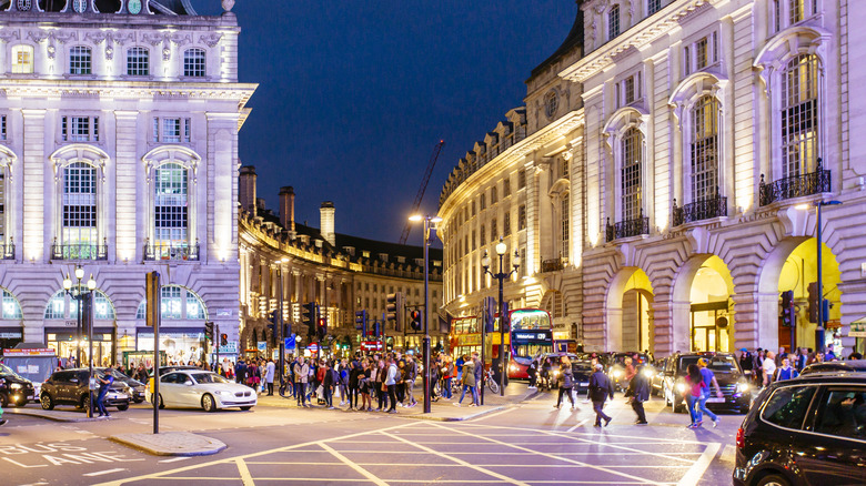 Crowds of people at night crossing Piccadilly Circus and Regent Street