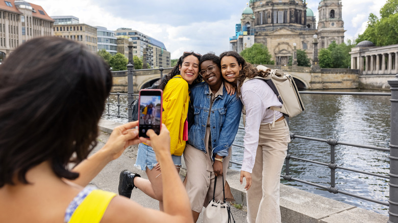 friend taking group pictures in front of Berlin cathedral