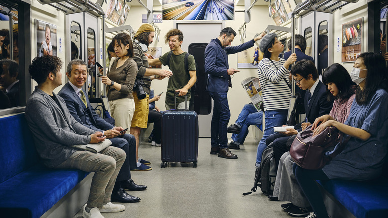 Passengers ride in a Japanese metro car