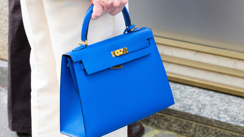 Woman carrying a fake hermes bag