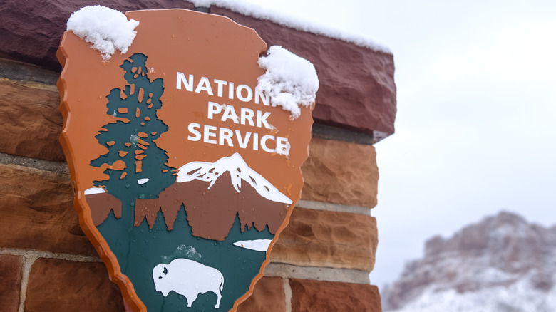 National Park Service sign covered in snow