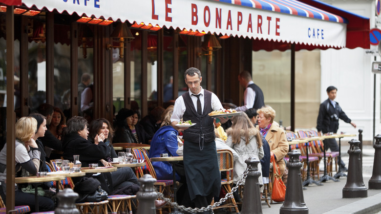 Café waiter coming to serve food