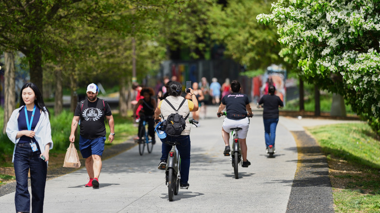Cyclists and walkers on the Atlanta Beltline in Piedmont Park, Atlanta.