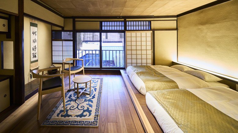 Japanese hotel room with futons and screened windows