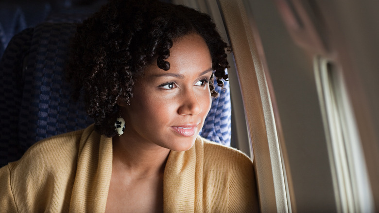 woman sitting in economy seats