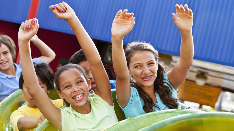 Girls smiling on roller coaster