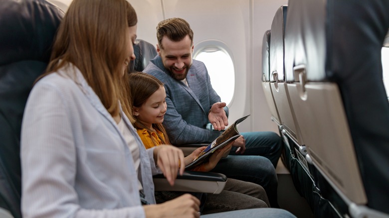 Family sitting on an airplane