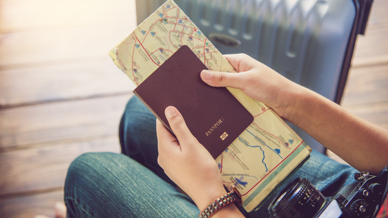 Hands holding travel documents