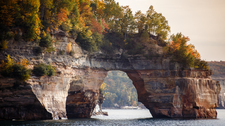arching cliff at Pictured Rocks with autumn trees