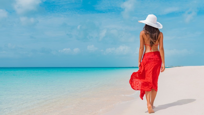 Woman walking on Barbados beach