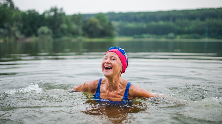 Laughing swimmer in a lake