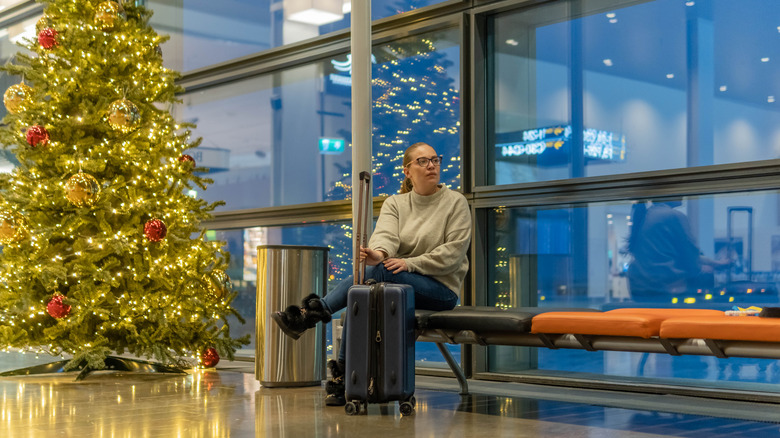 Woman in airport with luggage