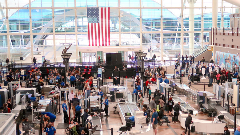 An overhead view of an airport TSA checkpoint.