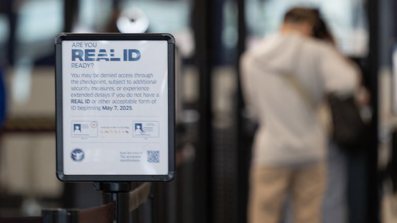 TSA security line with REAL ID sign and blurred background