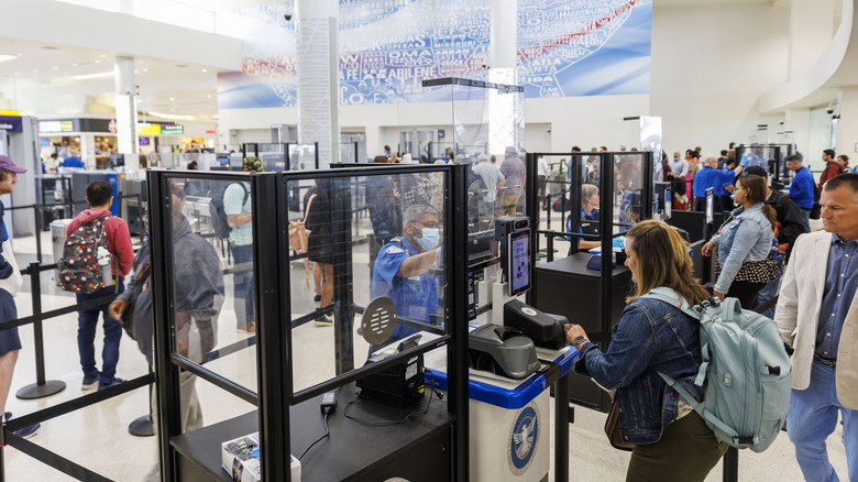 travelers in TSA checkpoint lines