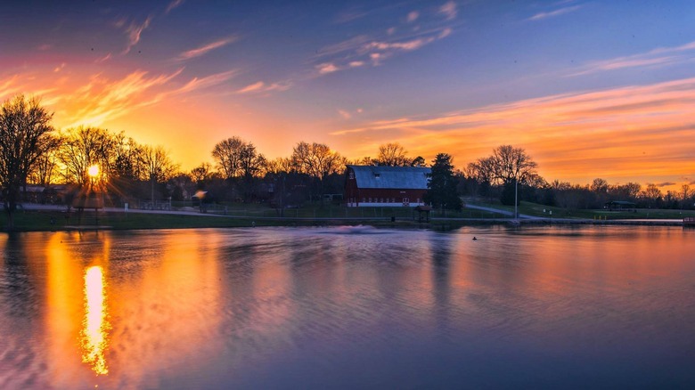 historic barn and pond at sunset in Crites Park