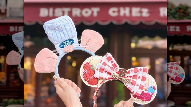 Woman holding disney ears in front of Chez Remy