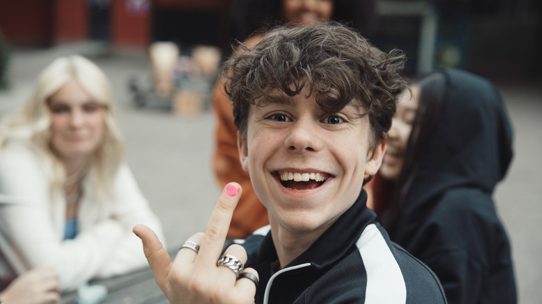 kid showing middle finger