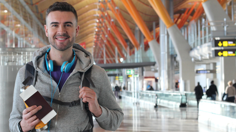 Man with passport in airport