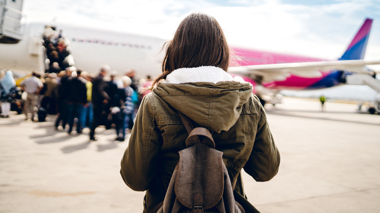 Travelers boarding flight