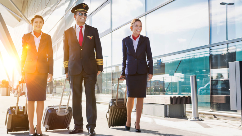 flight attendants with suitcases