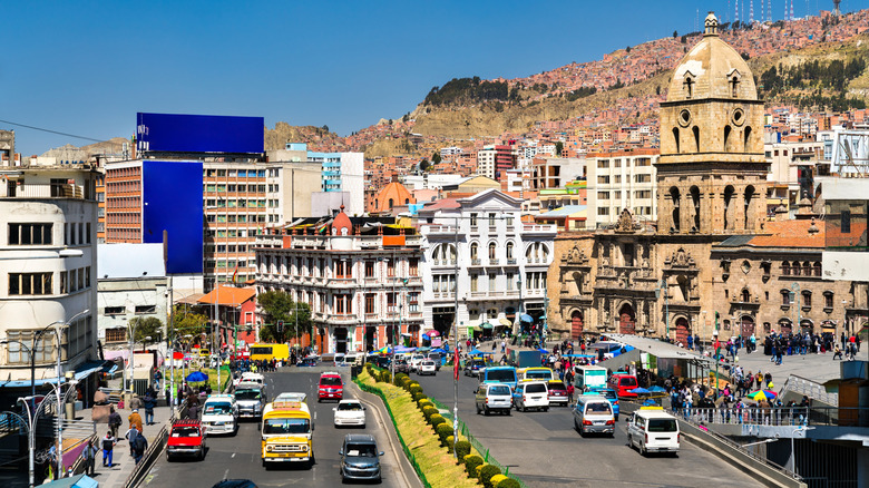 Cars on the road at major urban square in La Paz, Bolivia