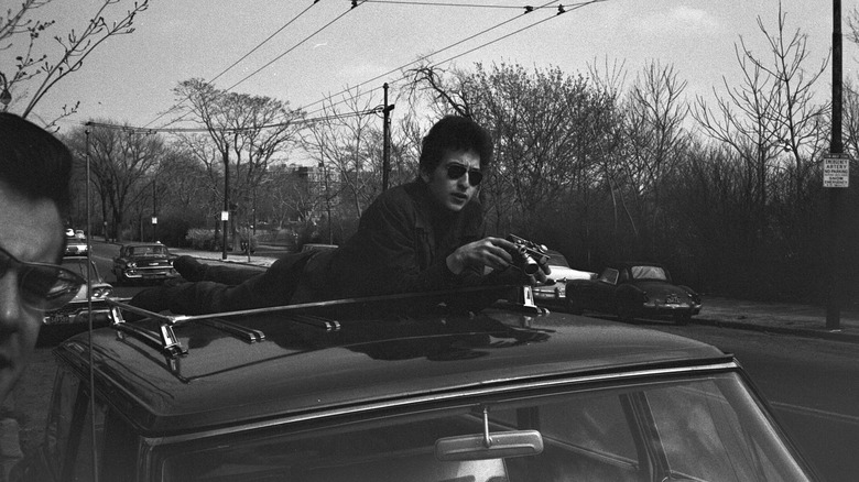 bob dylan on top of a car