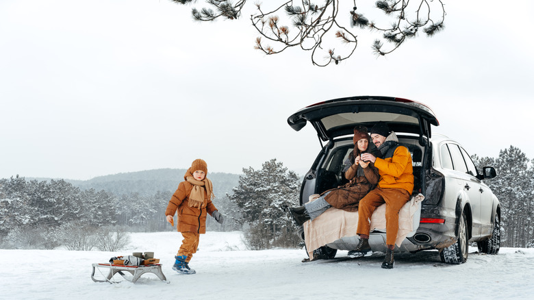 Couple in bed with heating pad