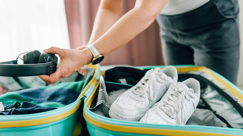 Shoes and headphones in suitcase
