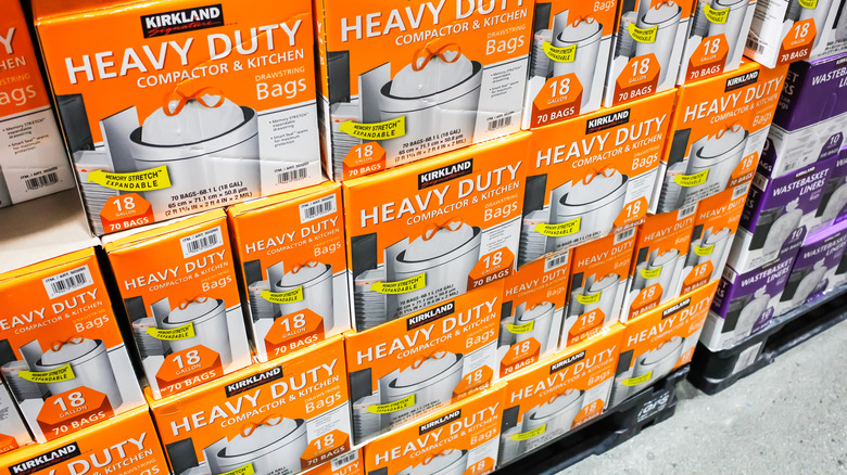 Shelf of compactor trash bags