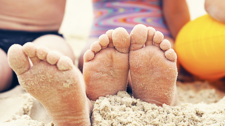 sandy feet at beach