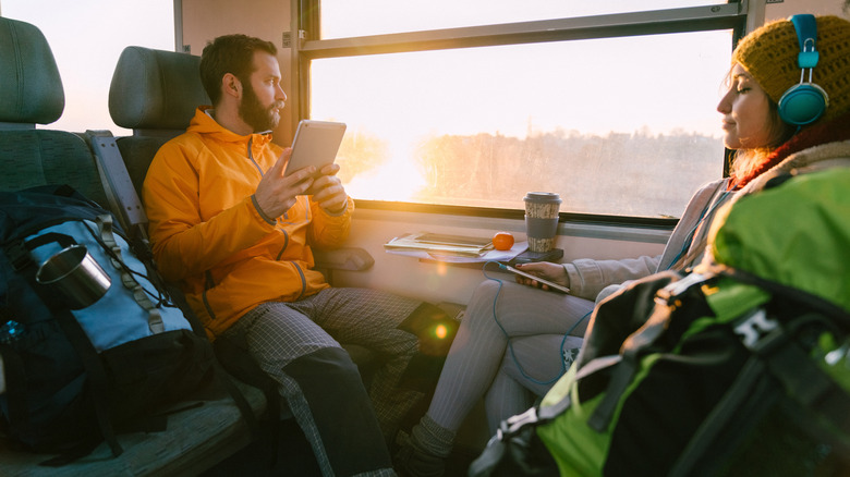 travelers riding a train