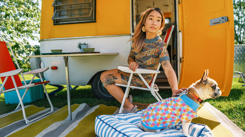Woman and dog with cute RV